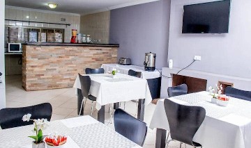 Dining area with tables and breakfast bar